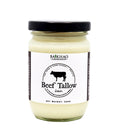 A glass jar of Baikhao Greenhouse Beef Tallow with a black lid and a white label featuring a black cow logo, set against a plain white background.