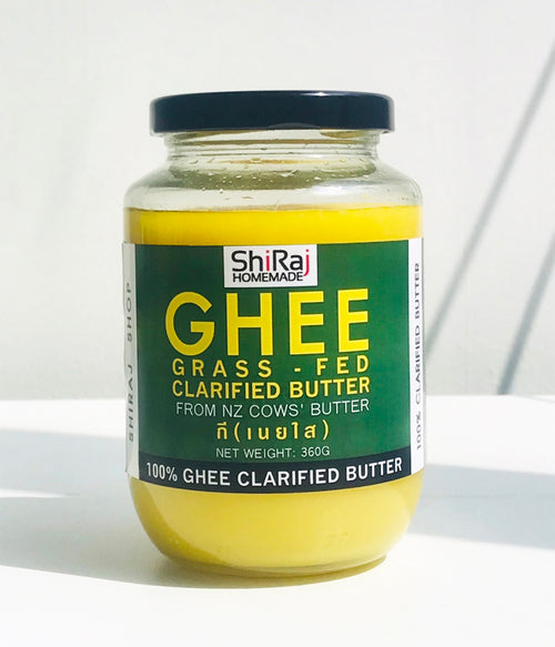A 350g glass jar of ShiRaj Homemade Ghee, showing the yellow butter inside and a dark green label with yellow text, sealed with a black lid on a white surface.
